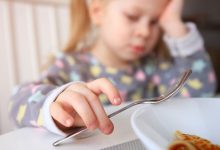 102106777 child eating getty